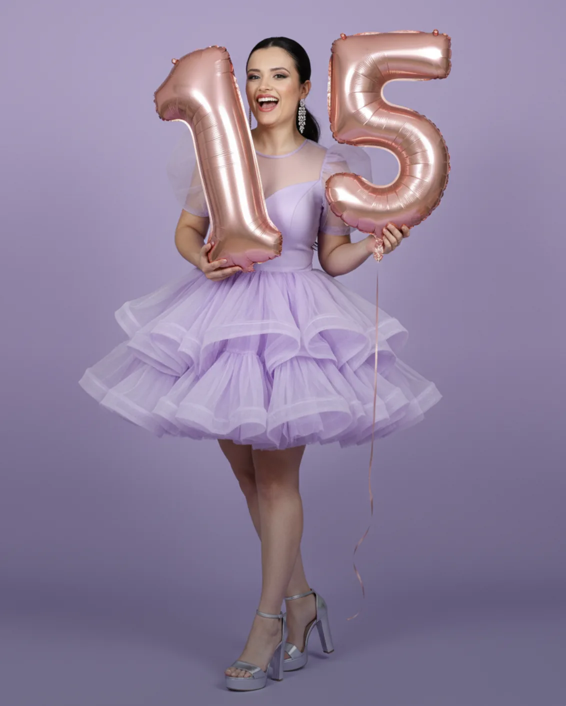 A full-length studio photograph with a...